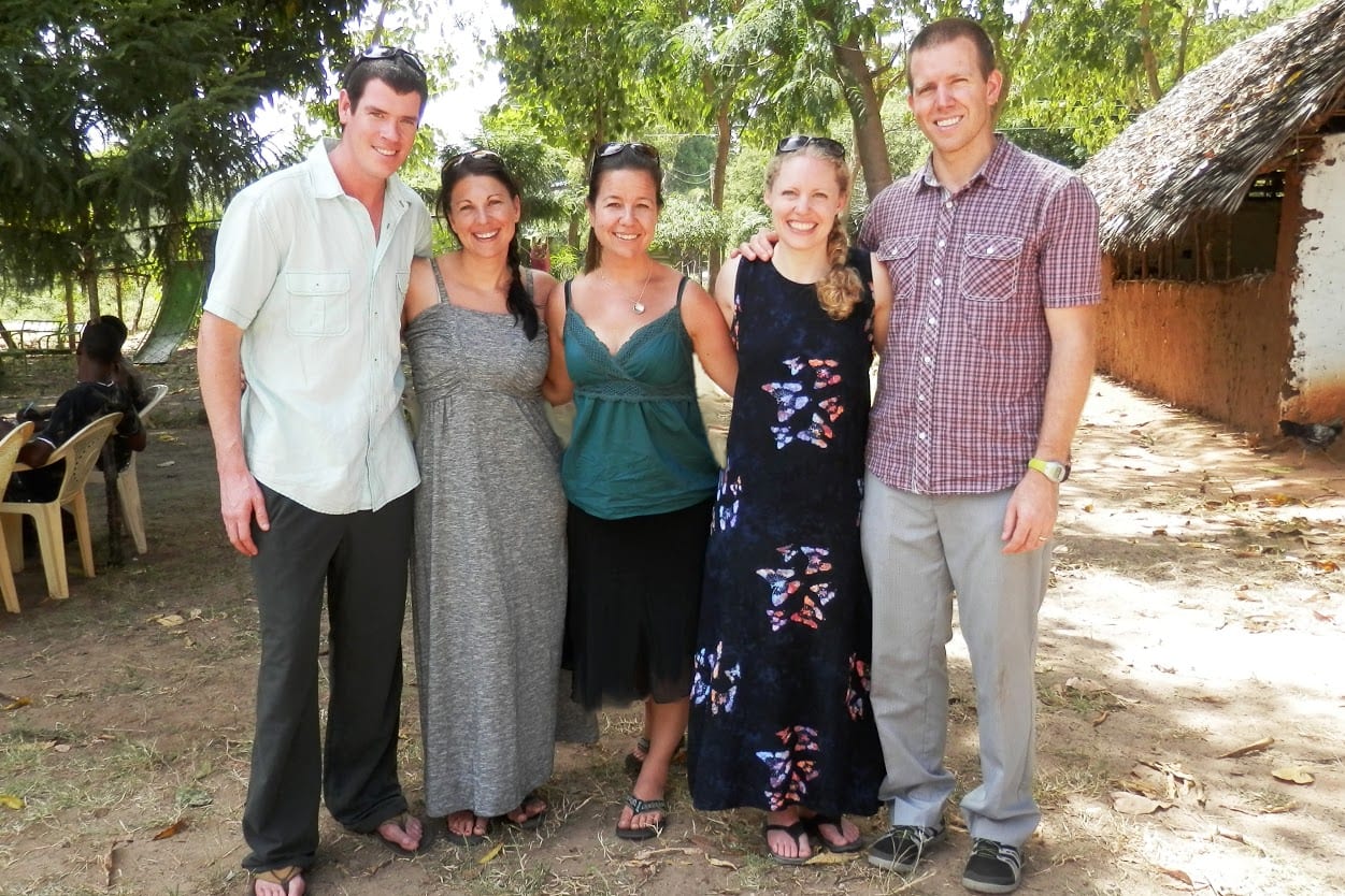 Three American females and two males all standing outside together.