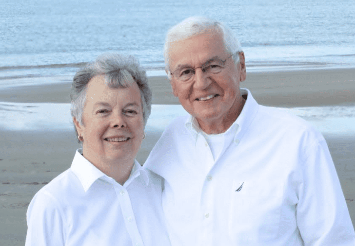 Dr. Richard Wright and Mrs. Ann Wright smiling while standing on the beach.
