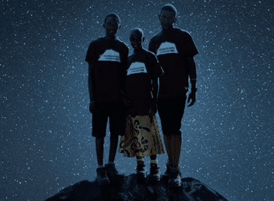 Kupenda Documentary cover- 3 Kenyan teens standing on rocky ground, surrounded by starry sky.