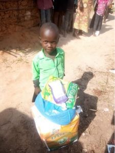 Samson receiving food support from Kupenda
