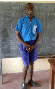 Nassir in a school uniform