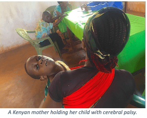 Kenyan Mother holding her child with Cerebral Palsy