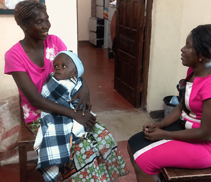 a woman holding her baby