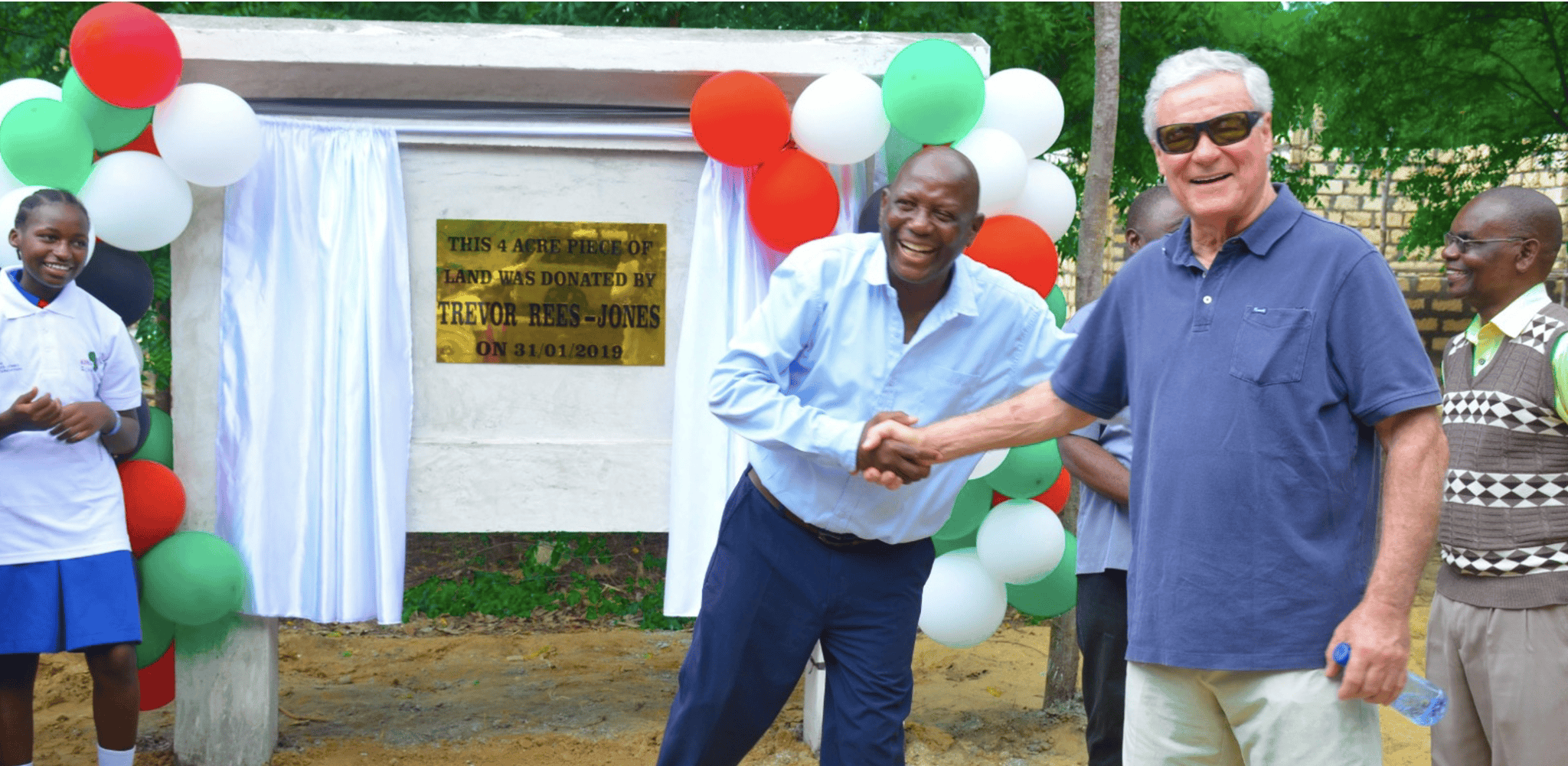 Trevor shaking hands at the unveiling of the with The Rees-Jones Foundation plack